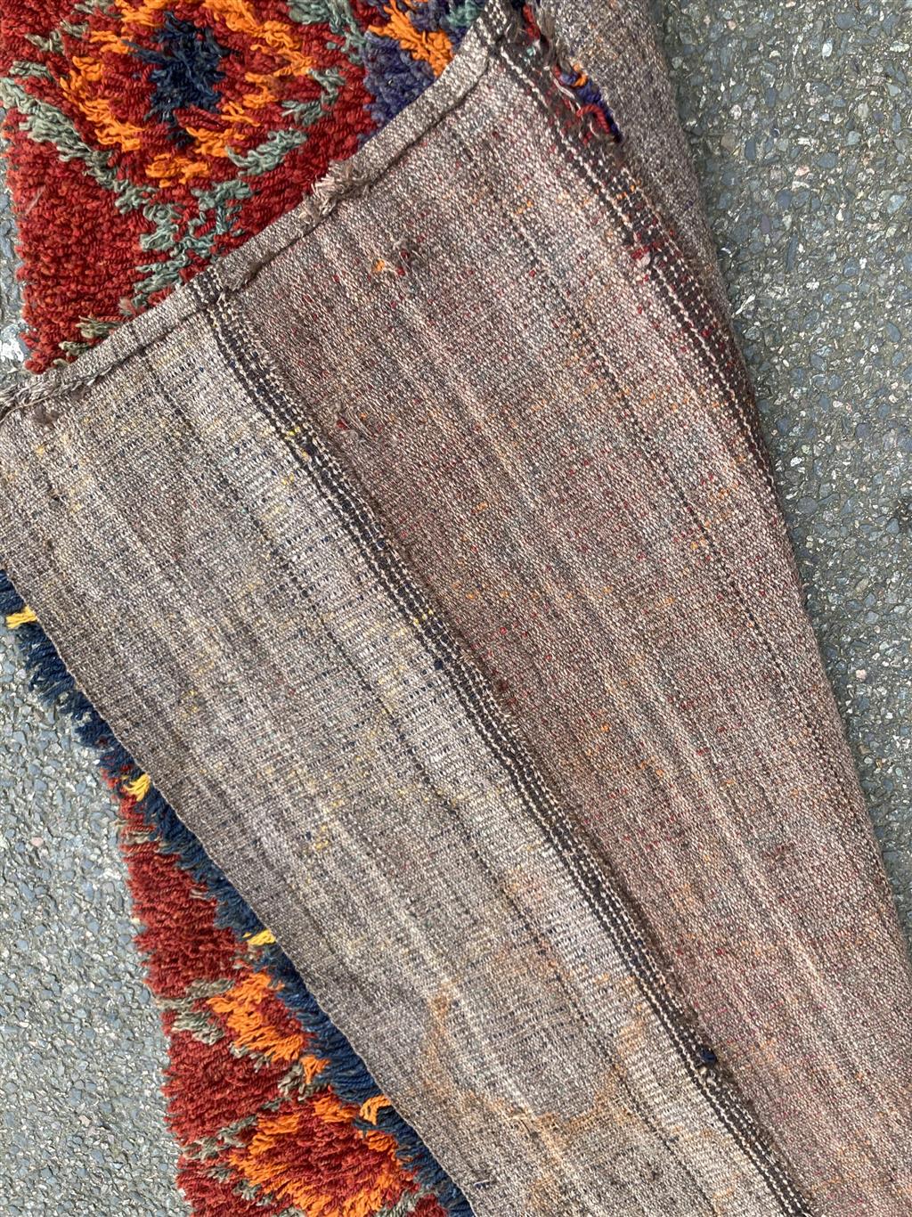 A Turkish wool rug, 187 x 114cm